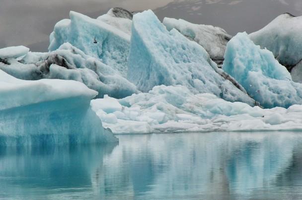 Floating blue icebergs in Jökulsarlon glacier lagoon, Iceland